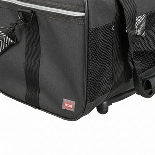 Black pet carrier with a visible brand logo on a white background