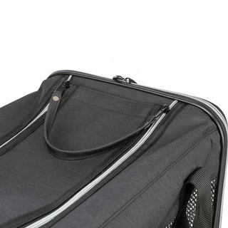 Close-up of a black suitcase with a zipper pocket on a white background