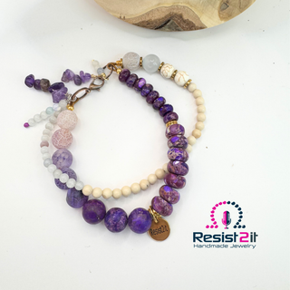 Mixed Feelings double gemstone bracelet with deep purple jasper and soft white agate stones, featuring the Resist2it gold charm — Jewelry by Jules