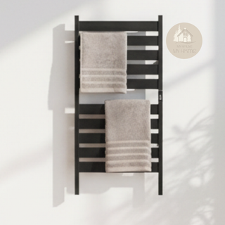 Black AUREA™ Electric Heated Towel Rail – 10 bars, hanging on the wall, with two beige towels and logo of MyHouseMyHome