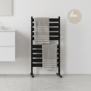 Black AUREA™ Electric Heated Towel Rail – 10 bars, standing on a bathroom floor, with two beige towels and logo of MyHouseMyHome
