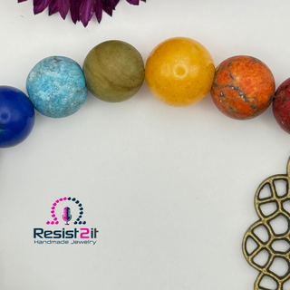 Close-up of multicolor natural stone chakra beads in ladies' bracelet, showing an explosion of vibrant rainbow energy tones