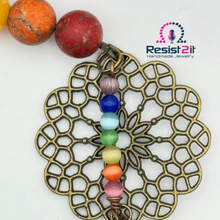 Antique brass mandala connector with chakra color beads in handmade Chakra Explosion bracelet by Resist2it
