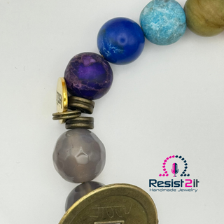 Detailed view of blue and purple natural stone beads and metal accents in Chakra Explosion bracelet