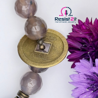 Faceted grey agate beads and vintage coin charm detail in Chakra Explosion bracelet