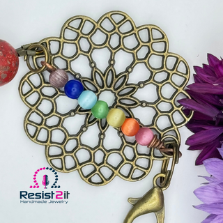 Chakra Explosion bracelet for ladies featuring antique brass mandala element and lobster clasp closure