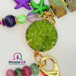 Close-up of druzy crystal chunky bracelet with gold details