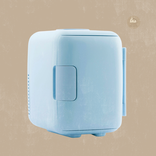 Small blue FRESCA™ Beauty Fridge on a beige background with a MyHouseMyHome logo