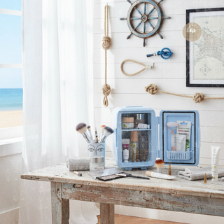 FRESCA™ Beauty Fridge containing beauty products, surrounded by nautical decor.