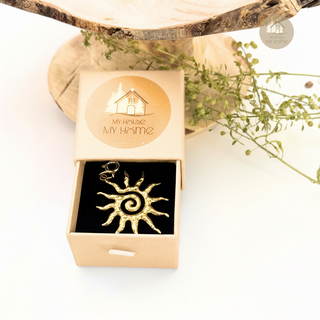 Jules' Solstice Charm™ in a gift box with 'My House My Home' logo