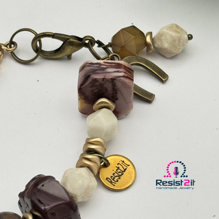 Close-up of detail of equestrian bracelet with natural gemstones - gift for horse lover - with Resist2it charm 