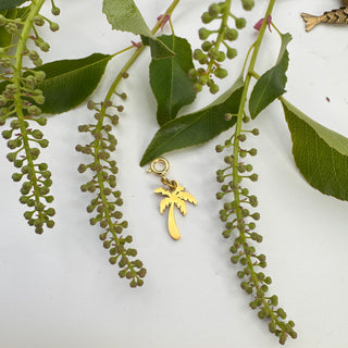 Jules' Golden Palm™ Tree Charmon green leaves against a white background