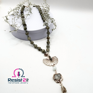 Artisan necklace featuring luminous labradorite, Czech glass beads, and quartz druze on white background