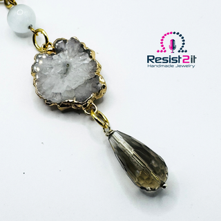 Detail shot of LABRADORITE MOONLIGHT™ Necklace showing the interplay of grey and white moonstone with faceted labradorite