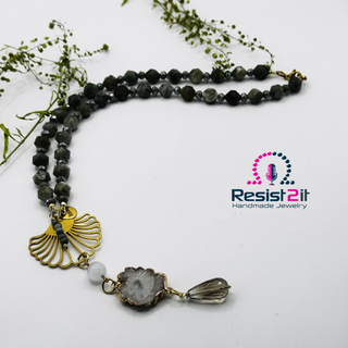 Handcrafted labradorite and moonstone necklace with delicate flower connector and natural gemstone details