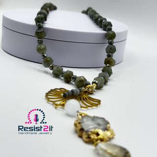 LABRADORITE MOONLIGHT™ Necklace with faceted beads and gold tassel on a white background, featuring Resist2it Handmade Jewelry logo.