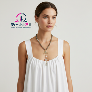 Woman wearing the LABRADORITE MOONLIGHT™ necklace with 'Resist2it Handmade Jewelry' logo in the corner.