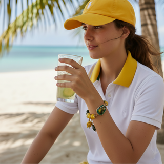 Woman wearing LITTLE TURTLES™ handmade turtle bracelet with natural gemstones