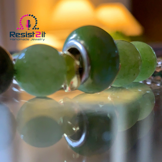 ON THE GREEN bracelet featuring multiple shades of green natural stones, featuring the Resist2it logo