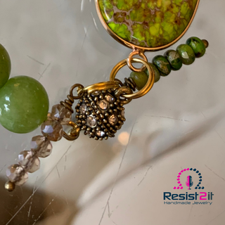 Magnetic rhinestone round clasp with green gemstone beads and a lime green connector
