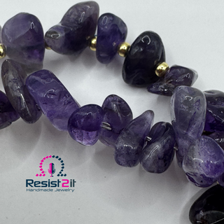 Detail of Violet Duality™ handmade amethyst bracelet  showing amethyst chips and gold colored seed beads