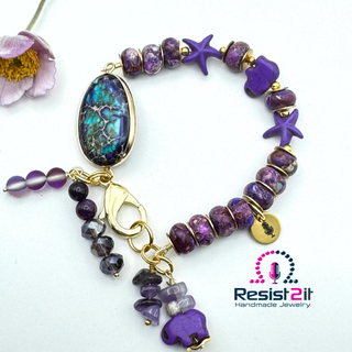 PURPLE TIDES™ handmade bracelet with emperor stone beads, starfish and elephant charms, featuring Resist2it Handmade Jewelry logo.