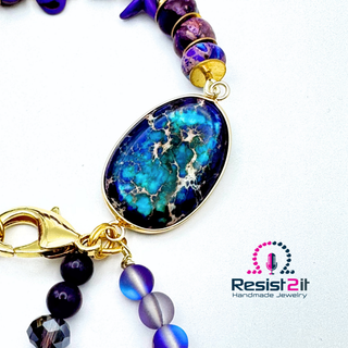 PURPLE TIDES™ with a blue marbled ocean stone connector and purple beads , featuring the Resist2it brand.
