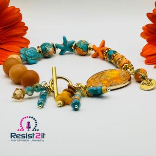 Detail of Turancia bracelet charms with faceted Czech glass beads and Swarovski crystal.