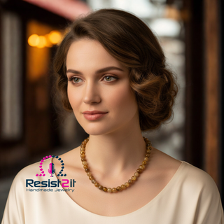 Woman wearing UNSPOKEN™ Tiger Skin agate necklace backwards without the pendant