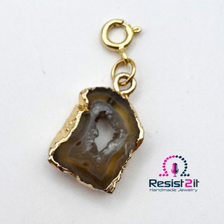 Agate pendant on a spring ring, belonging to the UNSPOKEN™ Tiger Skin Agate Necklace by Resist2it