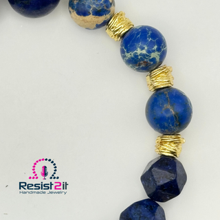Detail of a handmade beaded bracelet with blue natural stones and golden accents