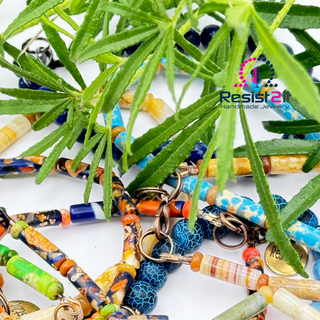 Resist2it men's bracelets lifestyle shot - natural stone men's bracelets with organic styling and green foliage