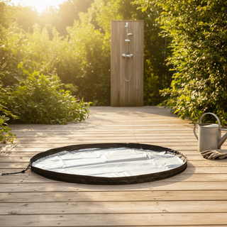 Portable hot tub on a wooden deck with a garden shower in the background